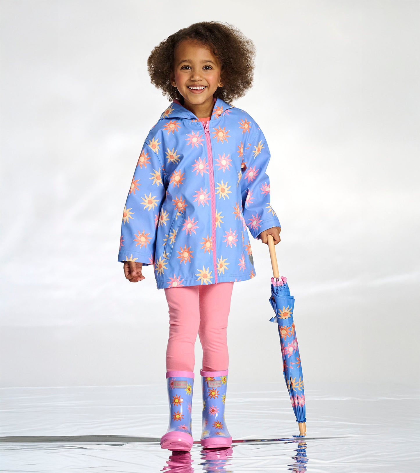 Veste de pluie à fermeture à glissière – Soleils décolorés