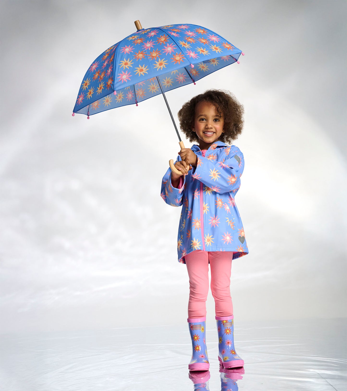 Veste de pluie à fermeture à glissière – Soleils décolorés