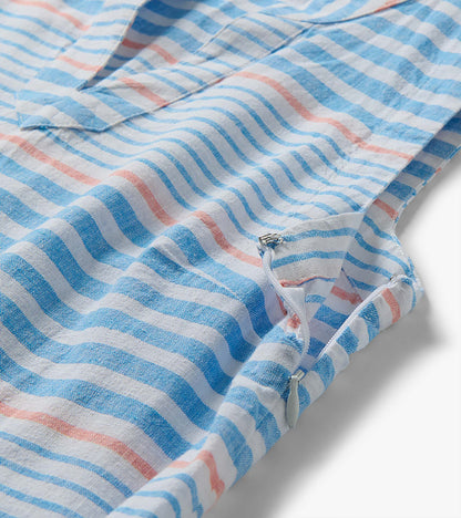 Close-up of Marin dress fabric with blue and white stripes, pink accent stripes, and a side zipper