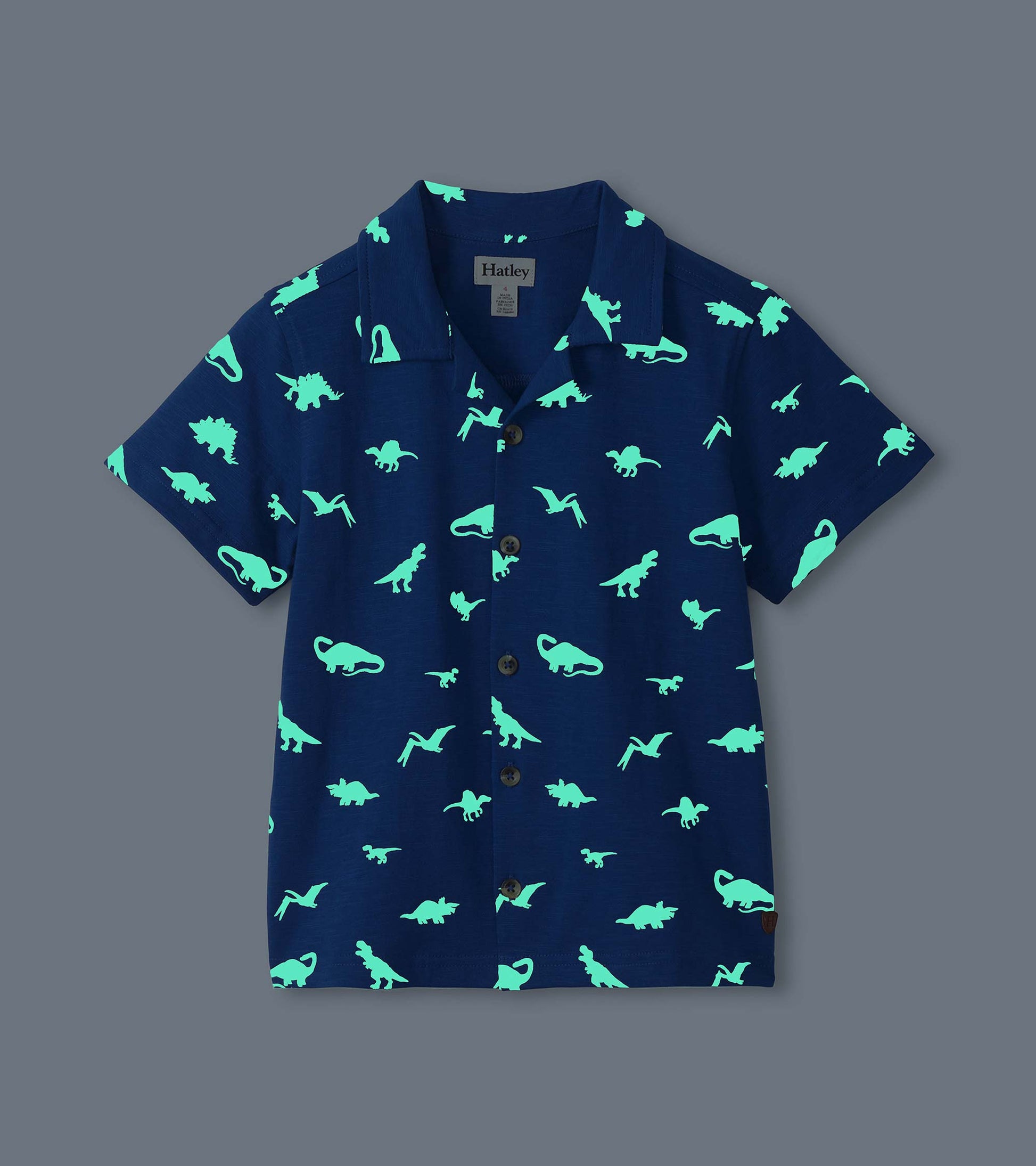 Navy short-sleeve button-down shirt with glowing teal dinosaur print, front view