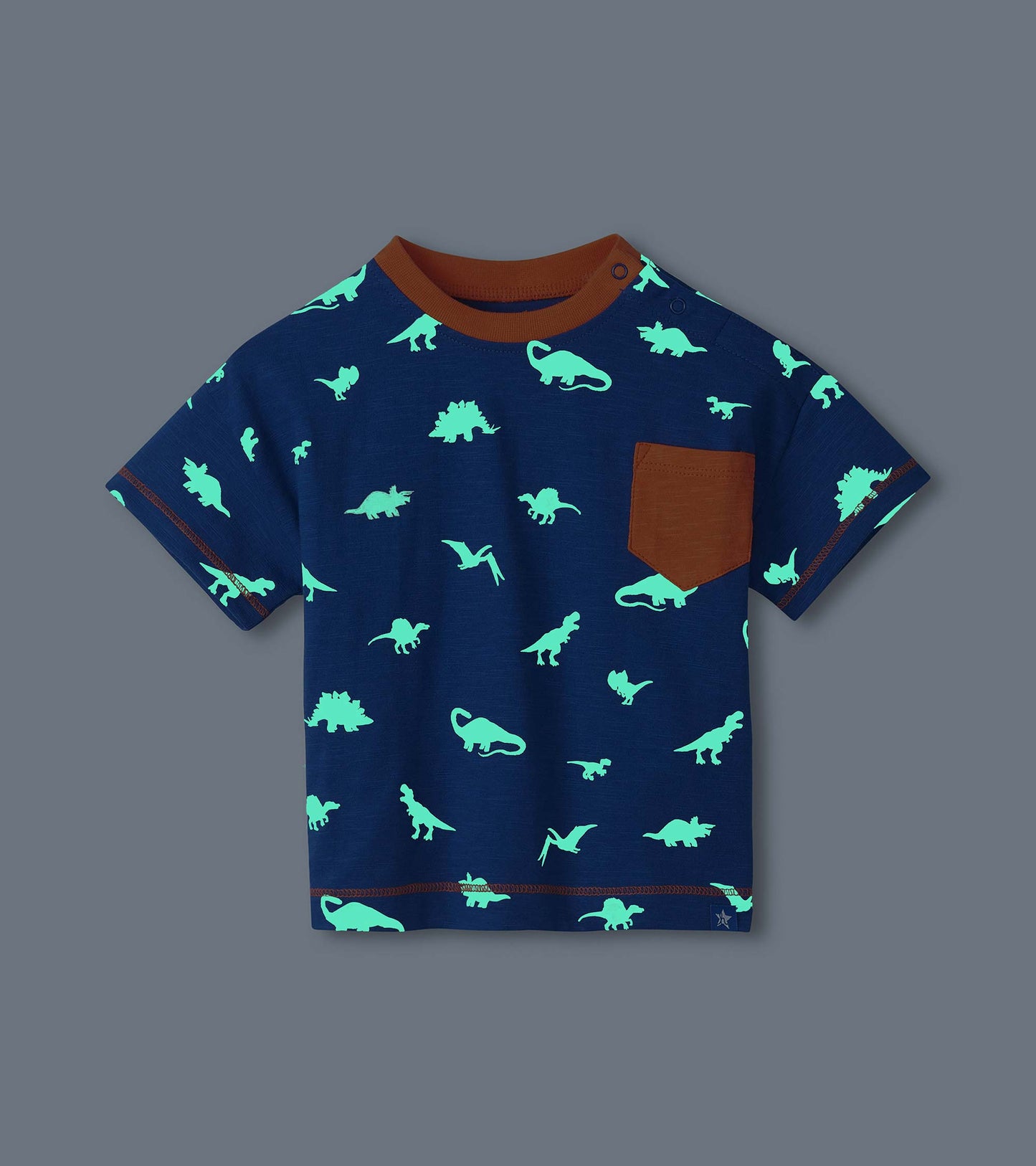 Navy short-sleeve toddler T-shirt with glowing dinosaur print, brown ribbed collar, pocket, and trim
