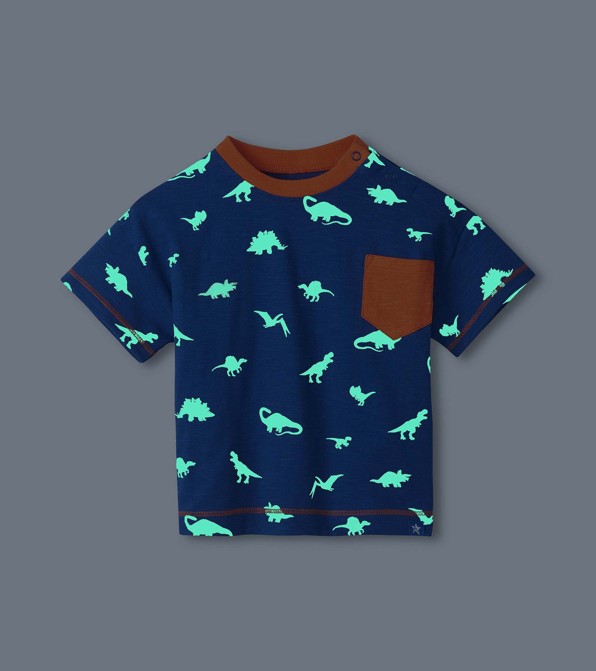 Navy short-sleeve toddler T-shirt with glowing dinosaur print, brown ribbed collar, pocket, and trim