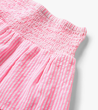 Neon pink and white striped seersucker skirt with smocked waistband, close-up detail view