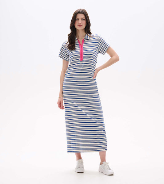 Front view of a white maxi dress with blue stripes, short sleeves, and a pink zip neckline, worn with sneakers