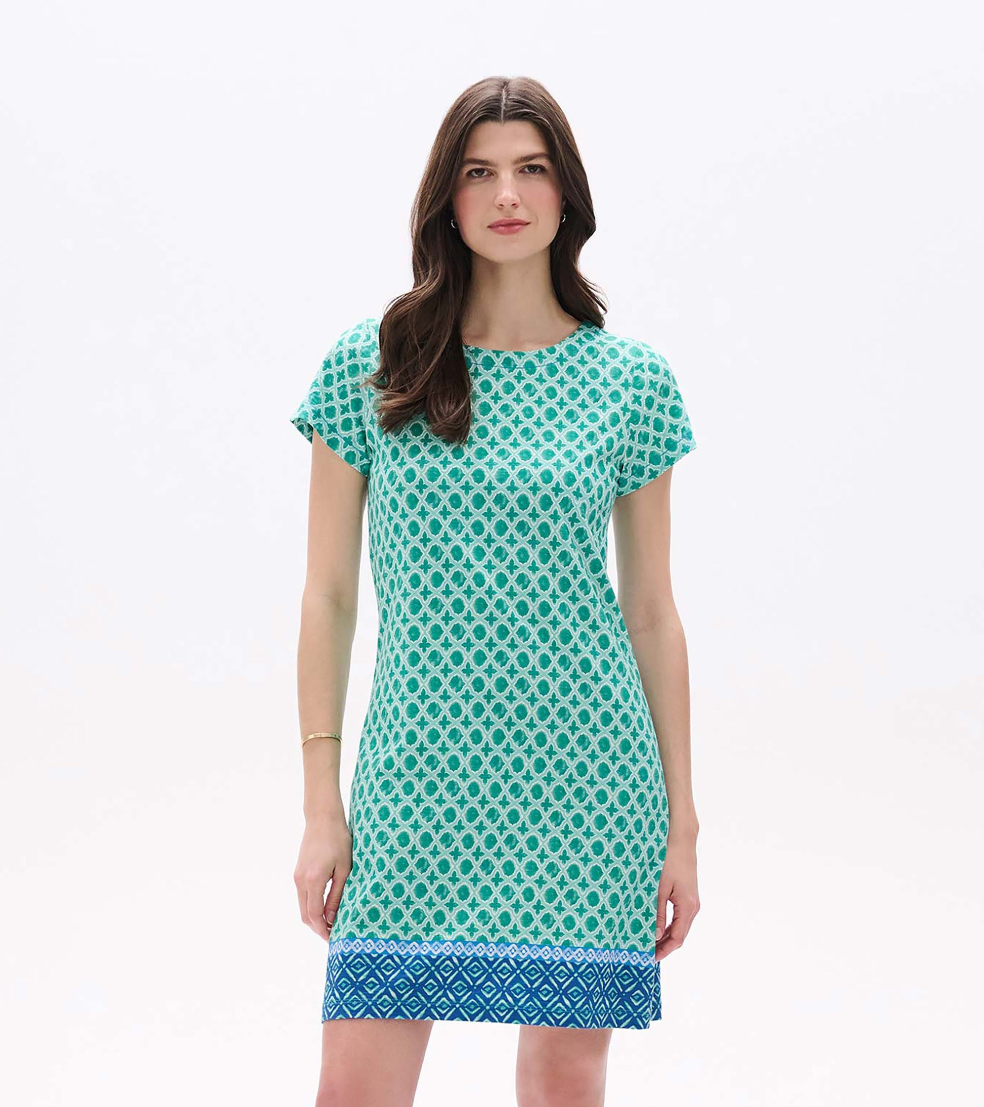 Front view of Arcadia Medallion tee dress in green and white with short sleeves and a blue border hem
