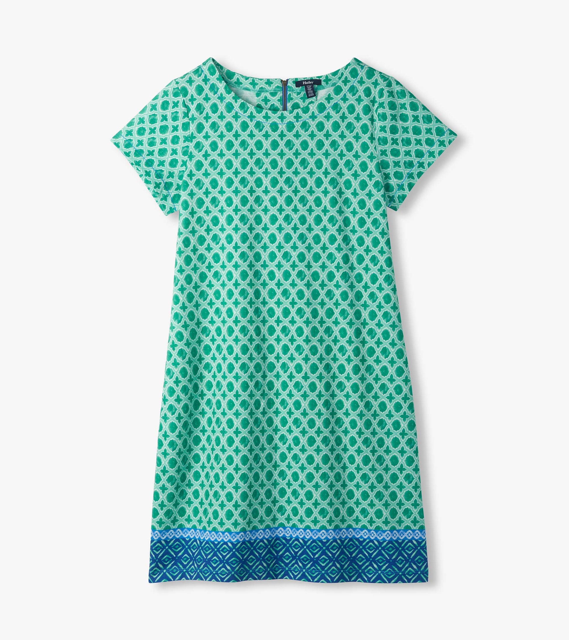 Flat lay of green and white medallion print tee dress with short sleeves and blue patterned border hem