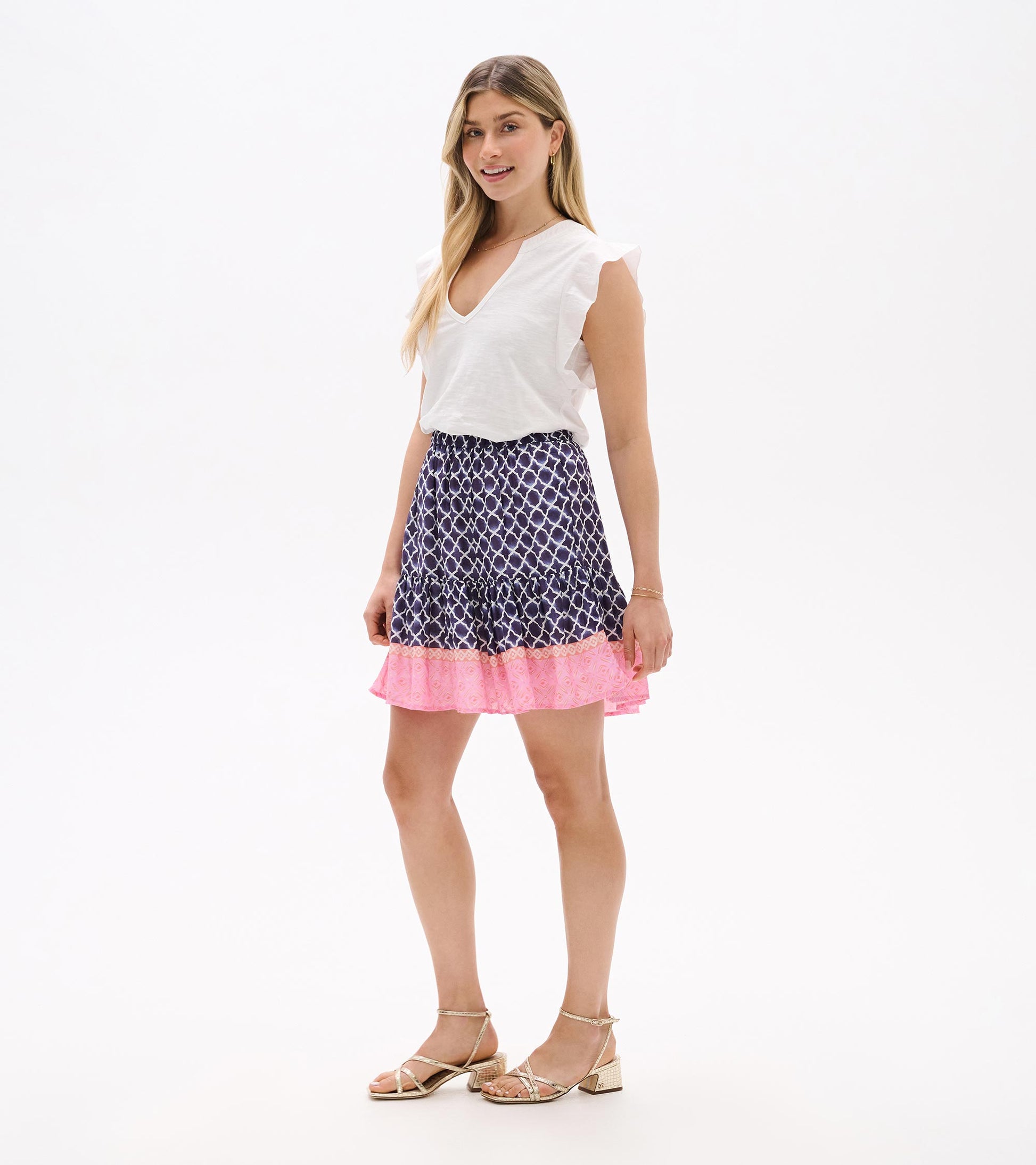 Navy and pink patterned flounce skirt with ruffled hem, shown on a model.