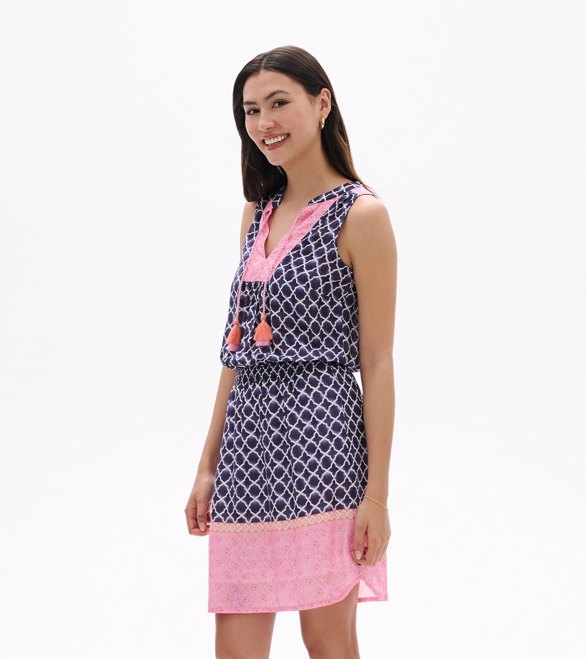 Sleeveless navy and pink patterned dress with tassel ties, front view