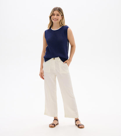 Navy blue sleeveless knit tank top with textured weave and ribbed trim, front view on model