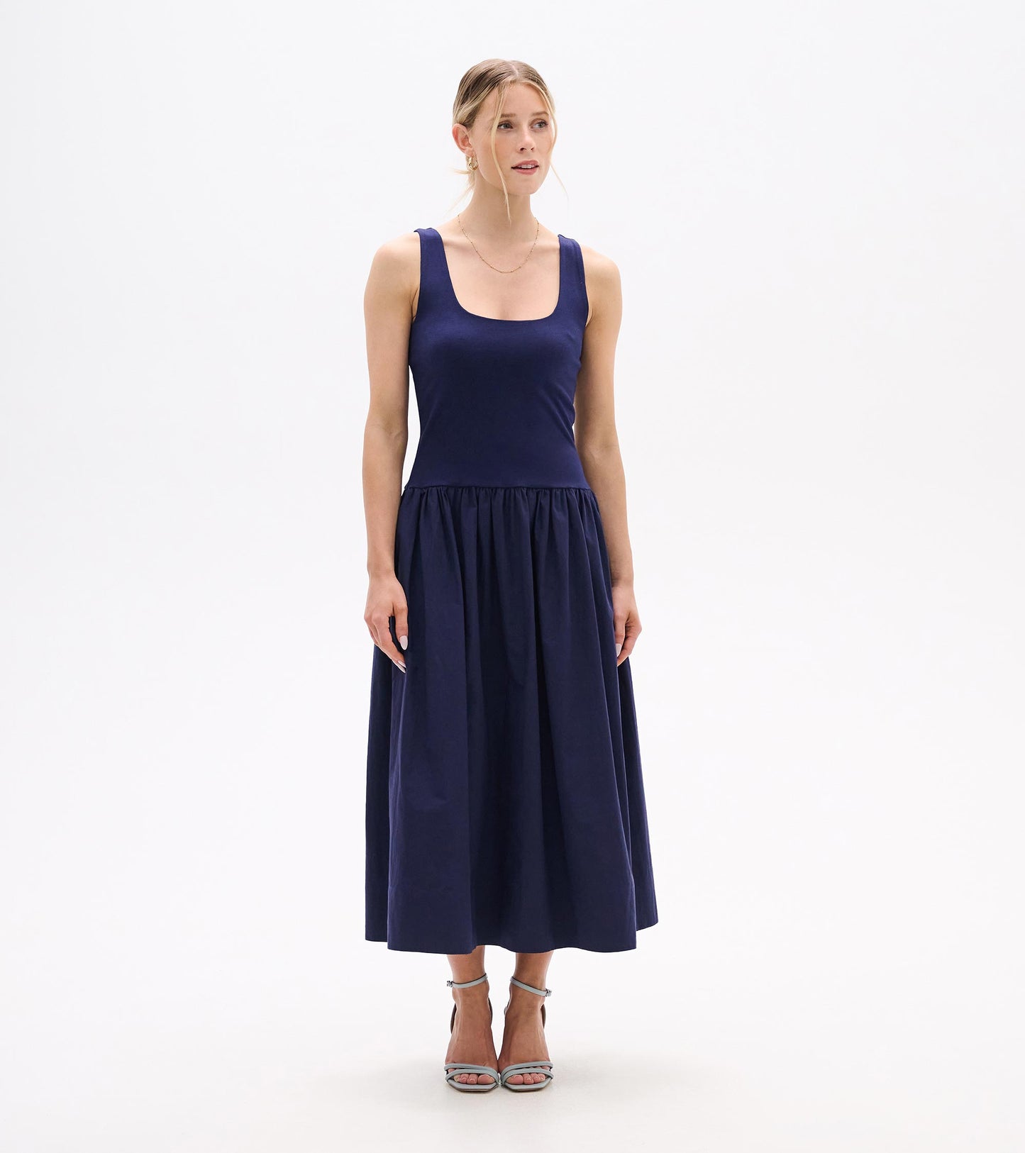 Sleeveless navy midi dress with scoop neckline and gathered skirt, front view