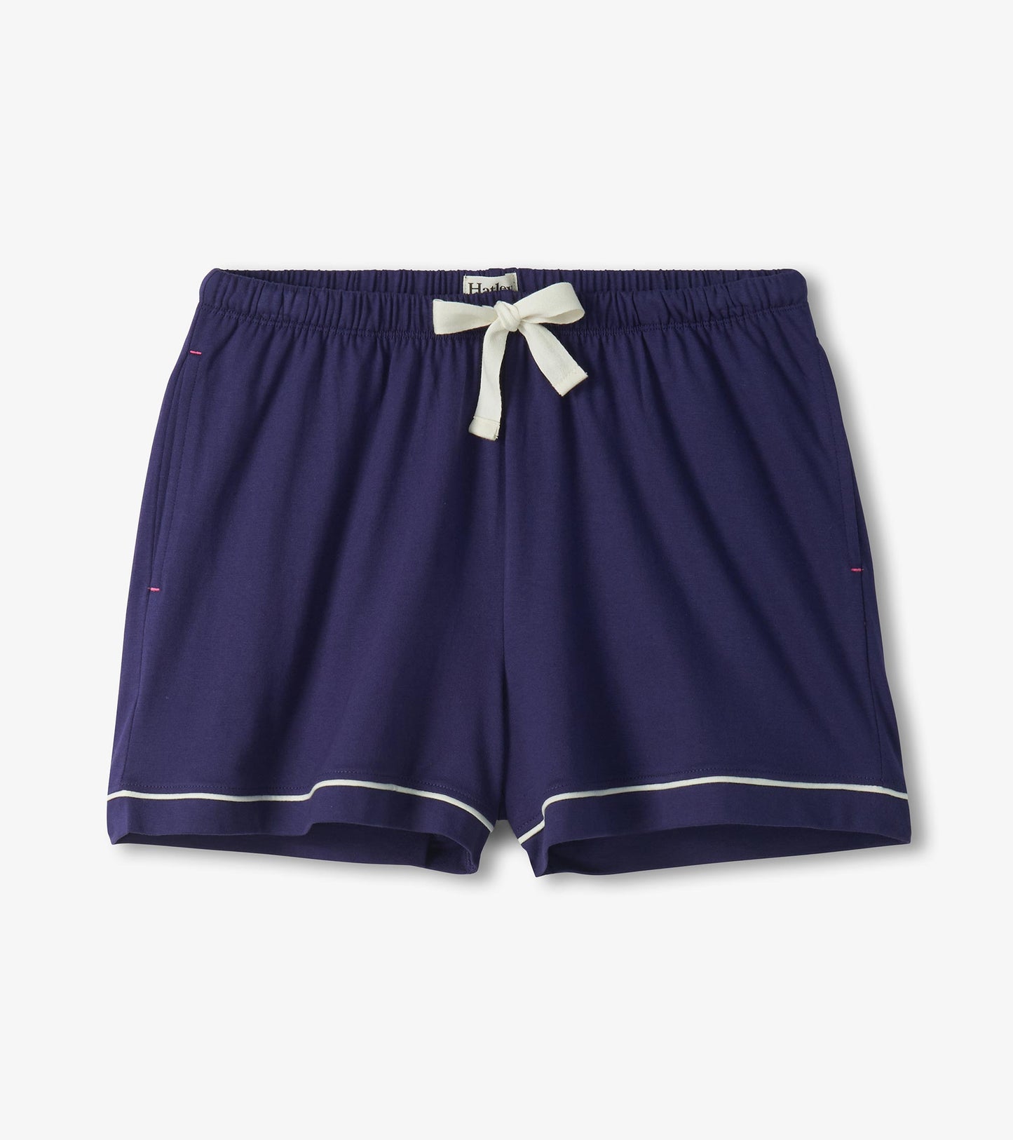 Navy pajama shorts with white trim at the hem and a white drawstring waistband