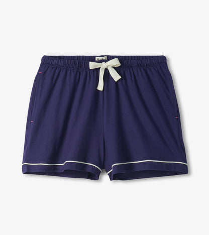 Navy pajama shorts with white trim at the hem and a white drawstring waistband