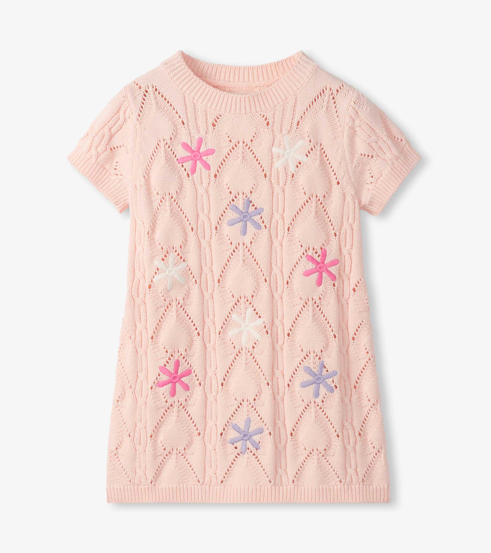 Light pink short-sleeve crochet dress with floral cutout pattern and multicolor flower appliqués, front view