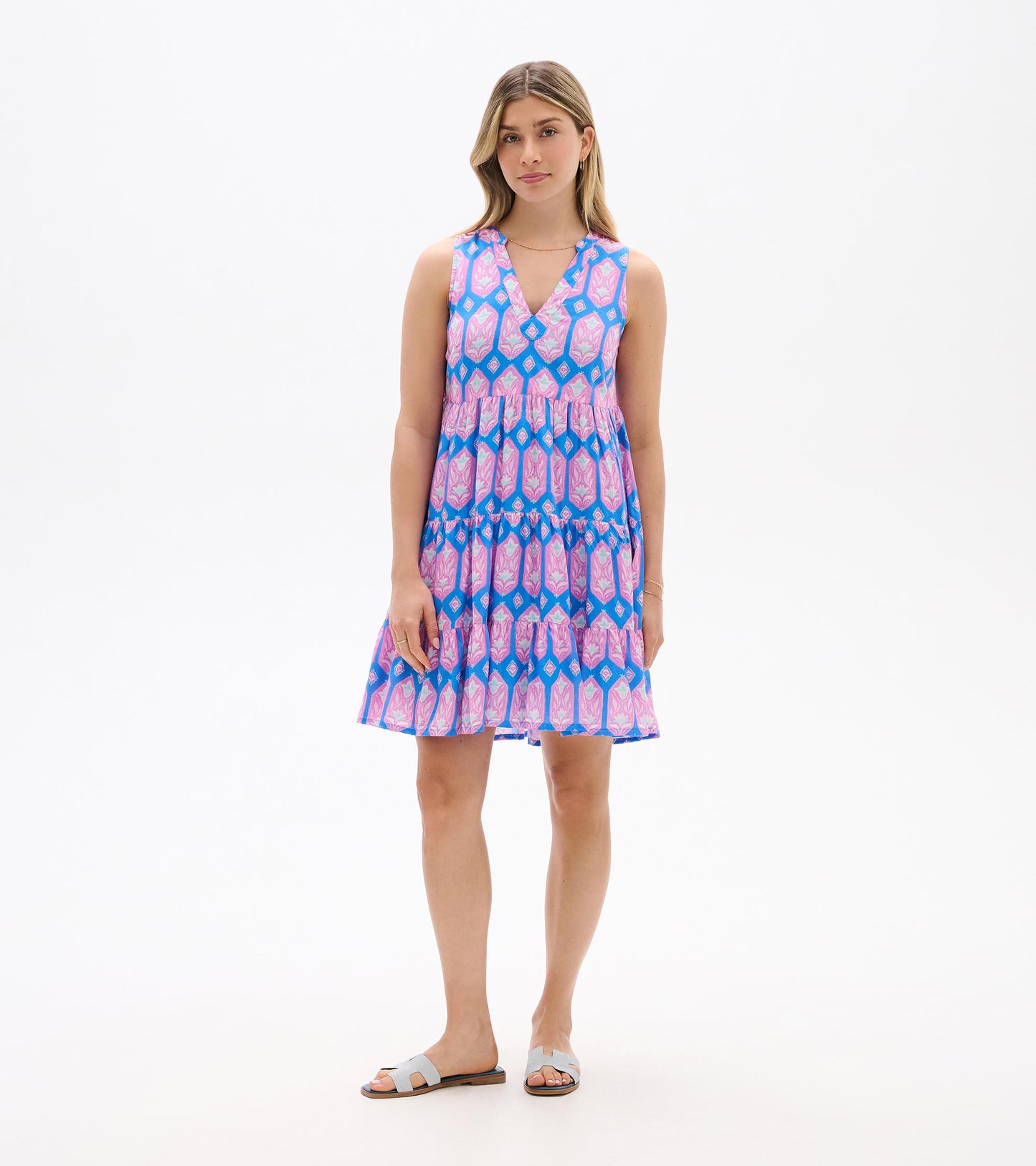 Sleeveless V-neck tiered dress with pink and blue floral geometric print, front view