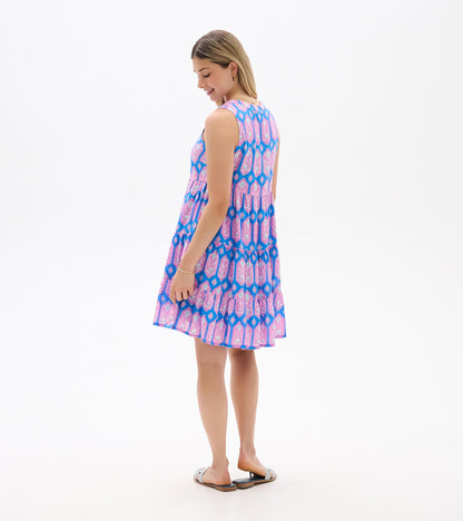 Sleeveless pink and blue patterned tiered dress, back view, knee length with a flared skirt