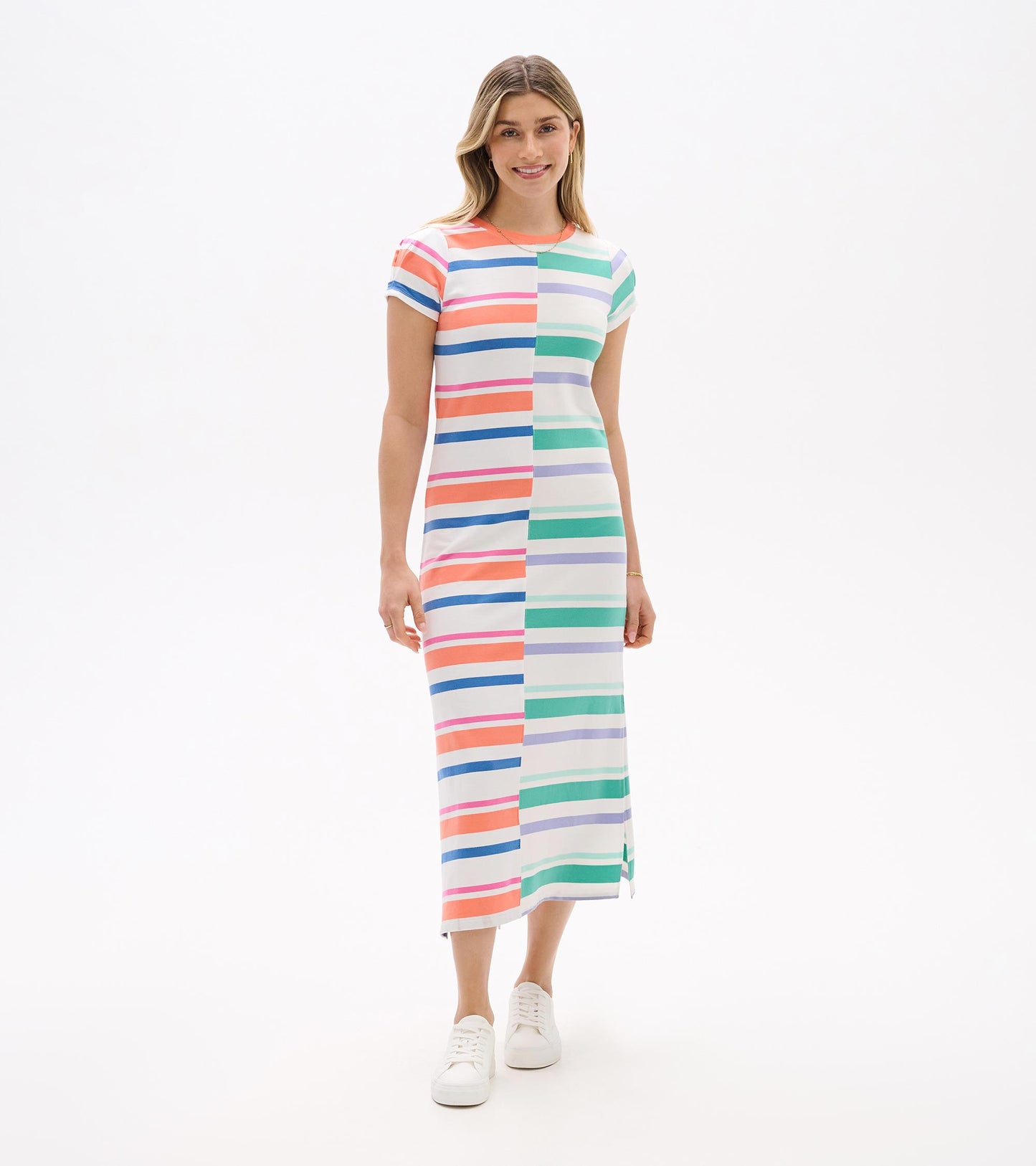 Front view of a short-sleeve midi dress with multicolor horizontal stripes and a straight silhouette, worn with white sneake…