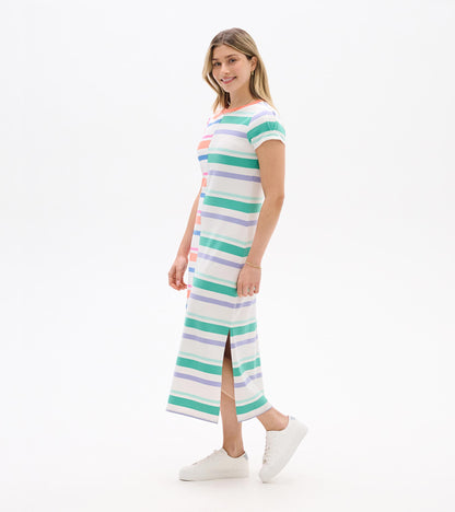 Woman wearing a white midi dress with pastel horizontal stripes, short pleated sleeves, and side slit, shown in side view.