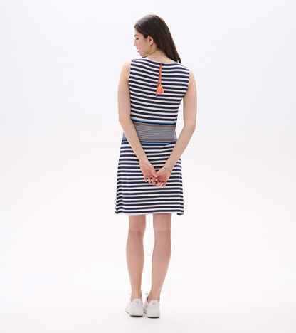 Sleeveless navy and white striped dress with coral tassel tie, back view, knee length