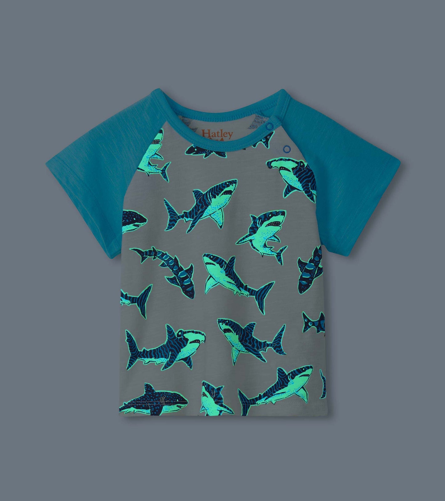 Gray and teal raglan T-shirt with allover glowing shark print, front view