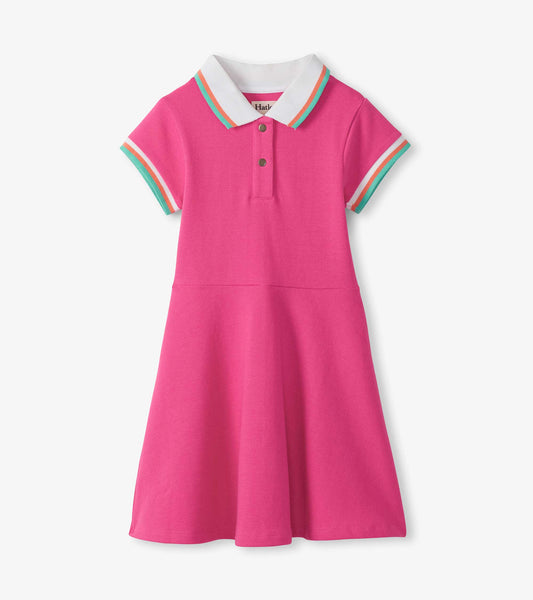 Pink short-sleeve polo dress with white collar and multicolor trim, front button placket, and flared skirt.