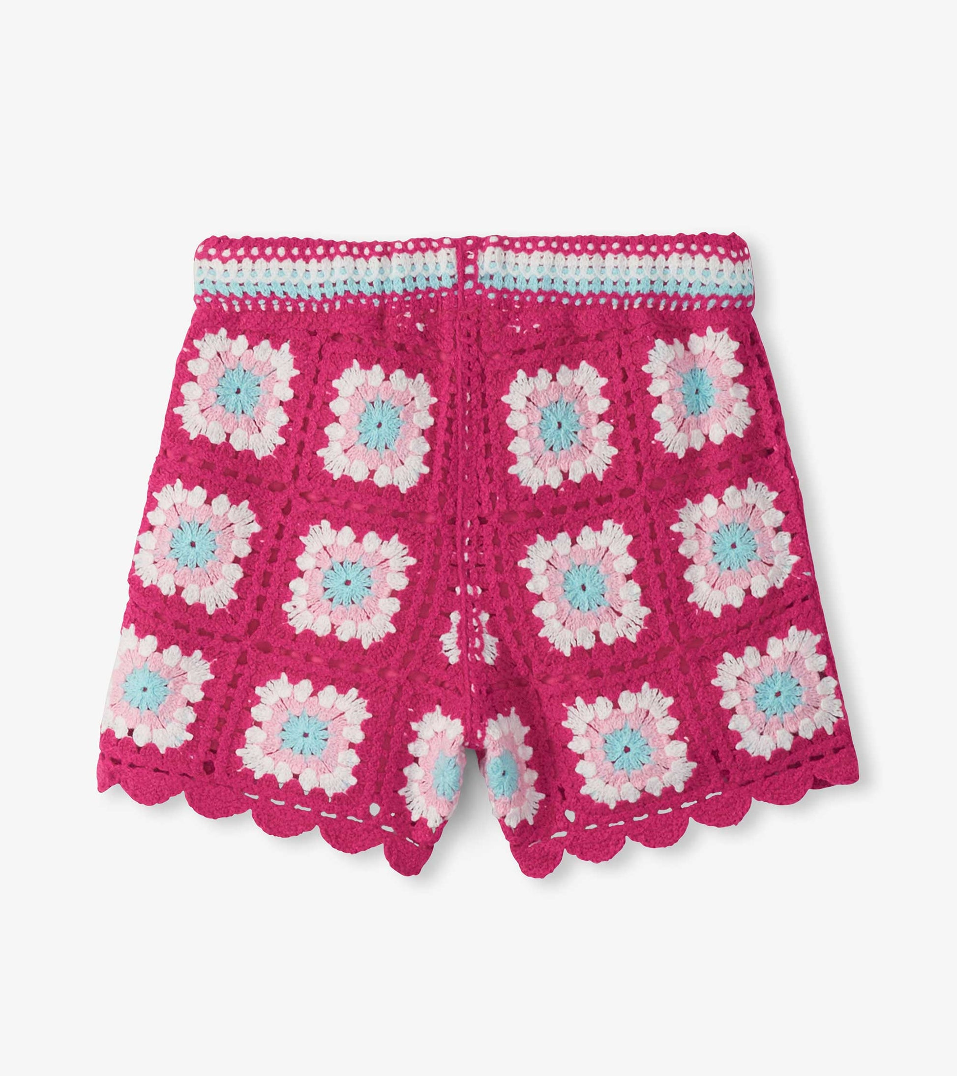 Girls pink crochet shorts with floral pattern and scalloped hem, front view