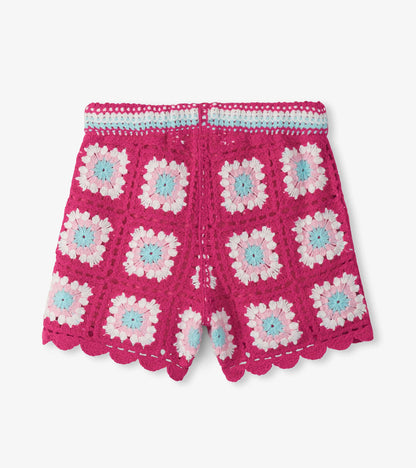 Girls pink crochet shorts with floral pattern and scalloped hem, front view