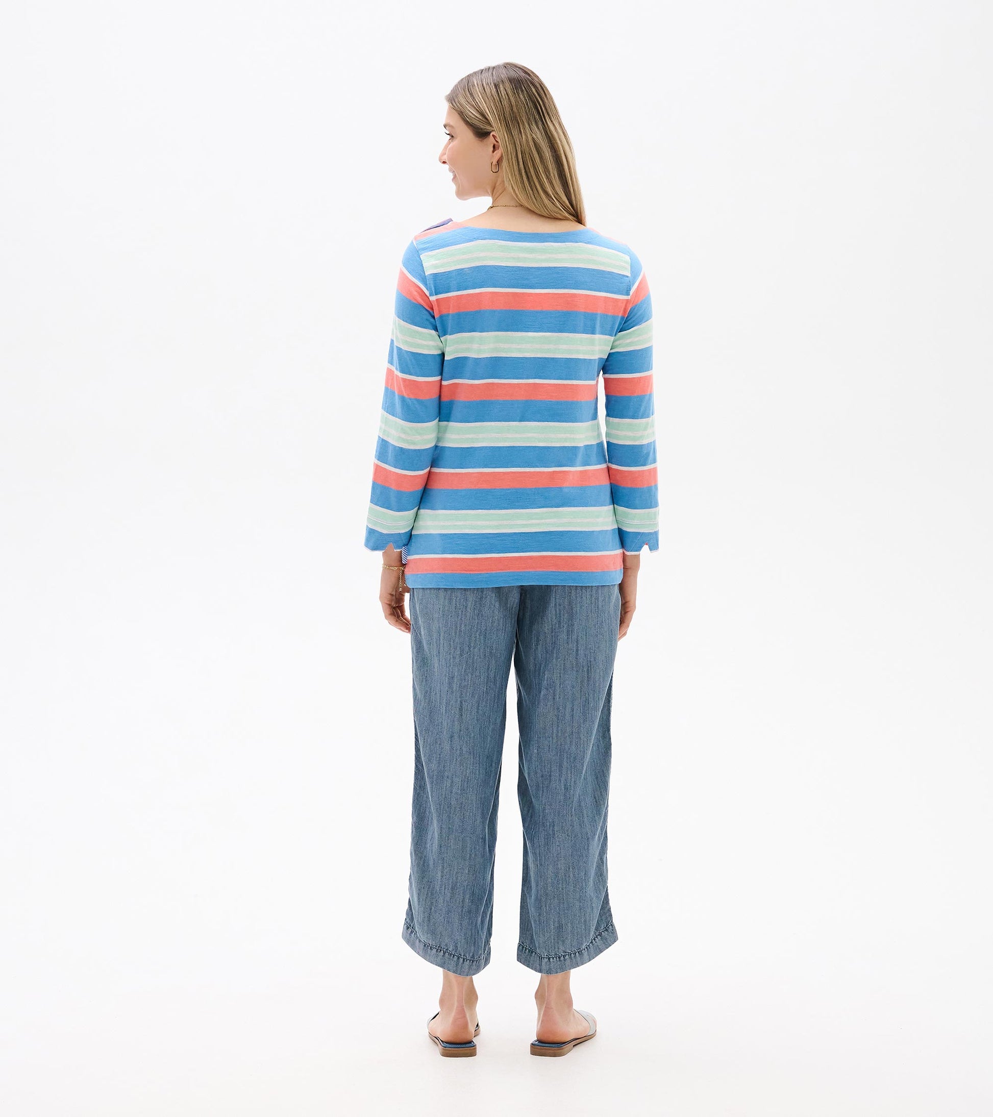 Back view of a blue striped long-sleeve top with coral and mint horizontal stripes