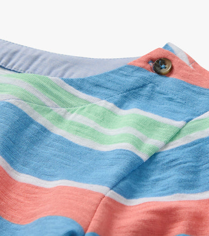 Close-up of a striped knit shirt in blue, coral, mint, and white with a buttoned collar detail