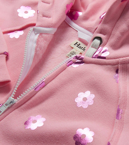 Pink girls zip-up hoodie with white floral print and drawstring hood, close-up view