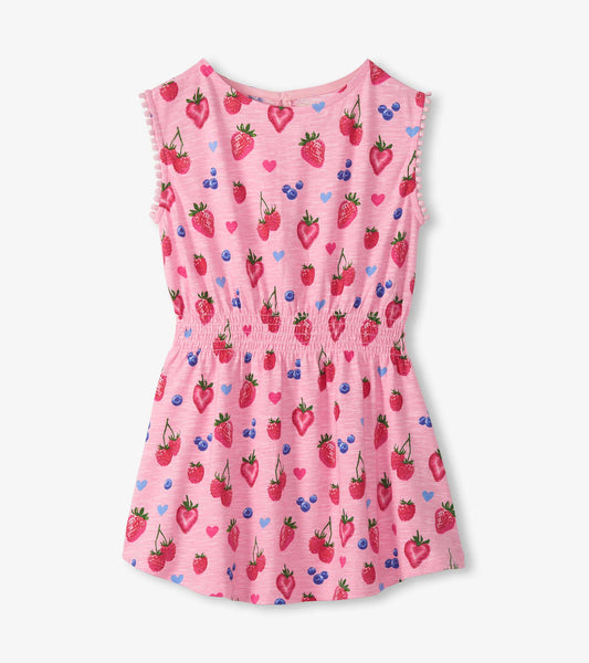 Pink sleeveless girls dress with strawberry, blueberry and heart print, smocked waist and pom-pom trim