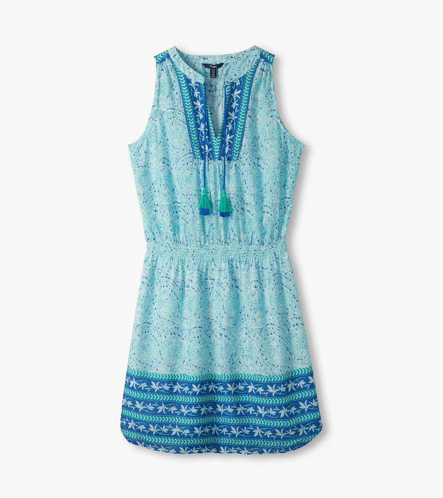 Sleeveless aqua and blue ikat print dress with V-neck, tassel ties, and elastic waist, front view