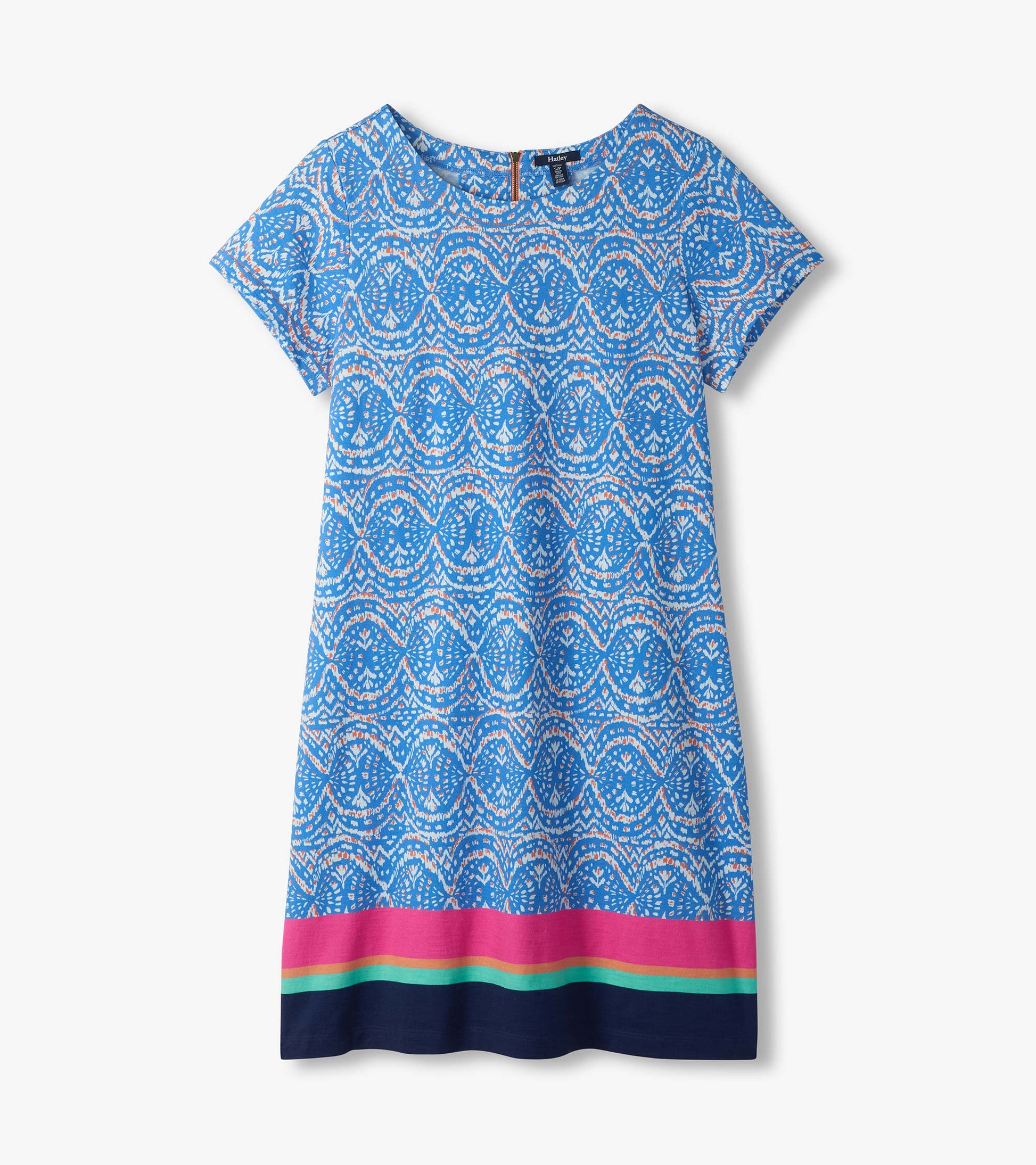 Flat lay of blue and white ikat tee dress with short sleeves and pink, aqua, and navy border hem