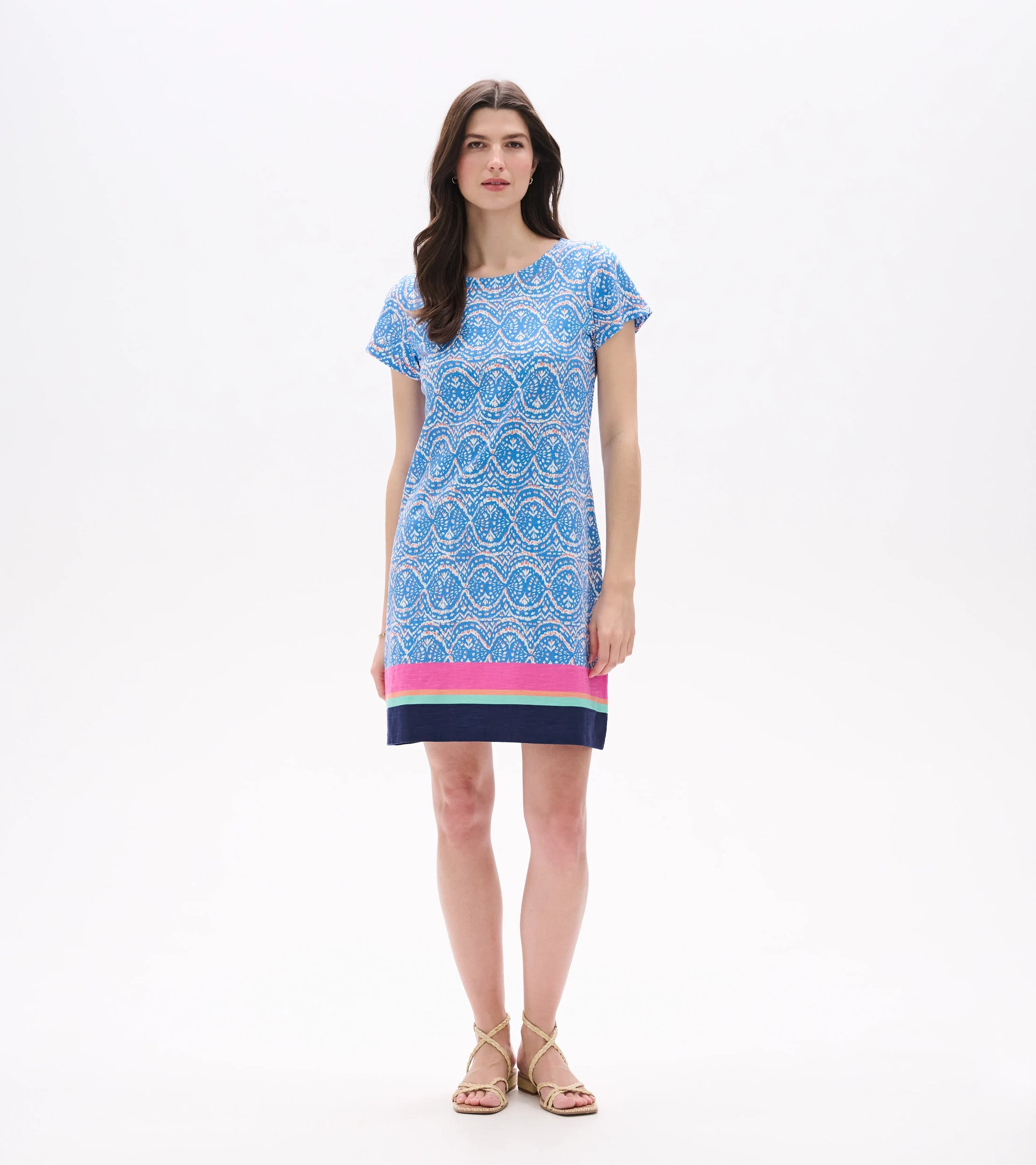 Front view of blue and white ikat tee dress above the knee with short sleeves and striped hem