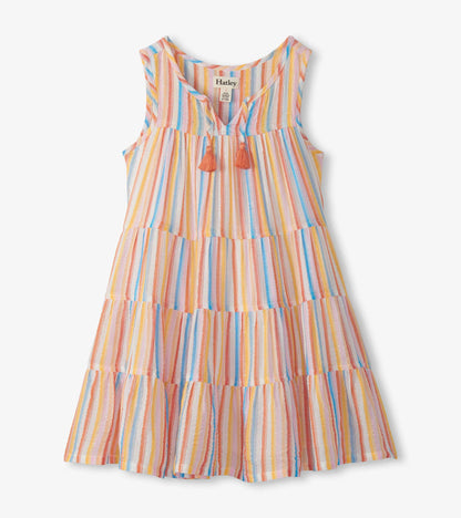 Sleeveless girls tiered dress with pastel vertical stripes, notched neckline, and coral tassel ties