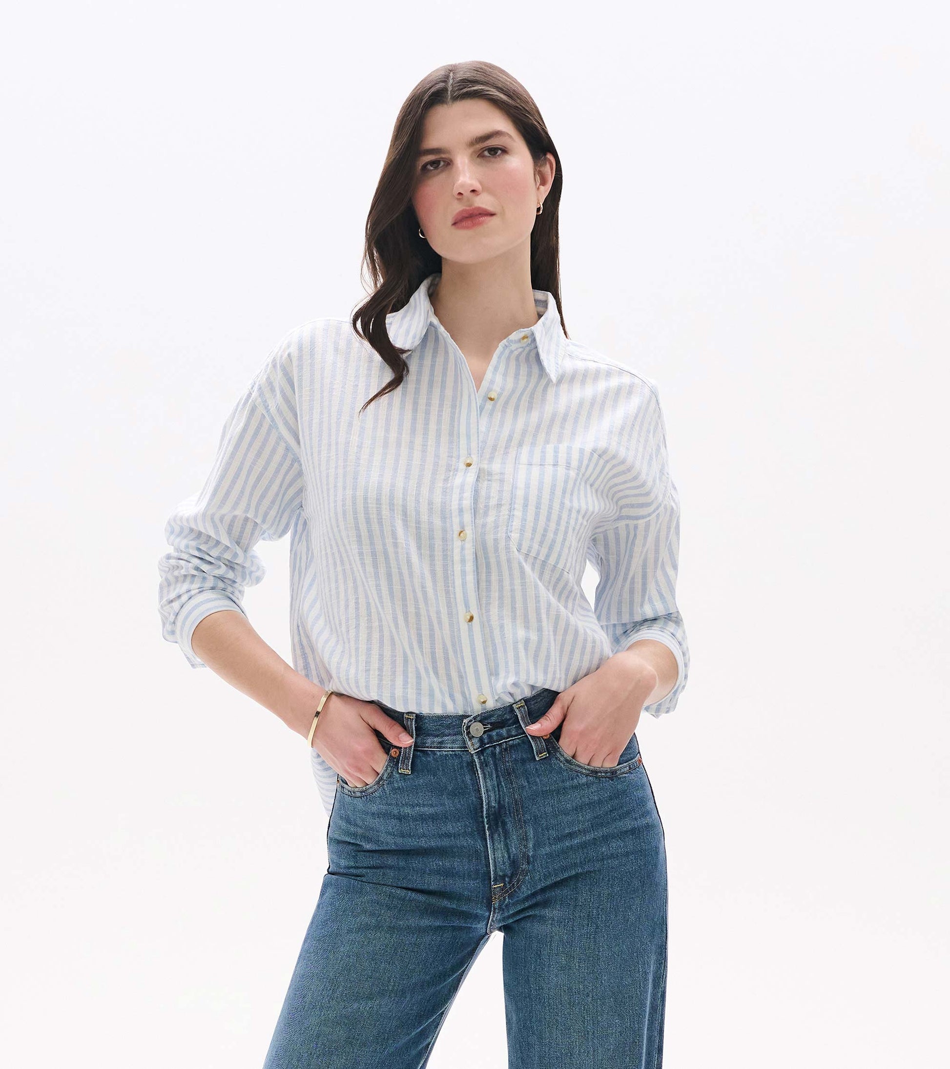 Front view of relaxed blue and white striped button-down shirt with collar and chest pocket