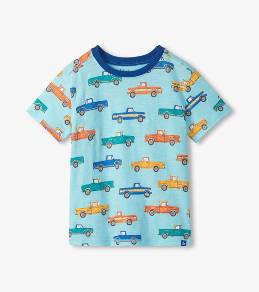Light blue boys T-shirt with multicolor pickup truck print and dark blue crew neck, front view