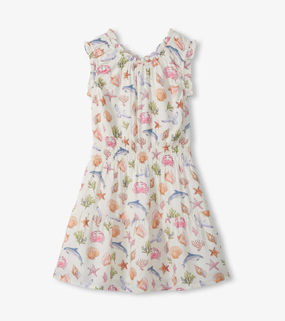 Girls cream gathered dress with sea life print, ruffled sleeves and flared skirt, front view
