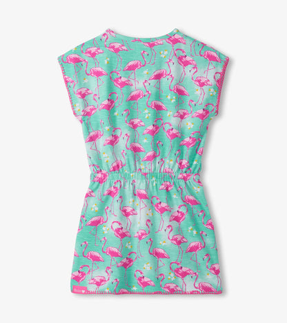 Girls turquoise dress with pink flamingo print, short sleeves, and cinched waist, front view
