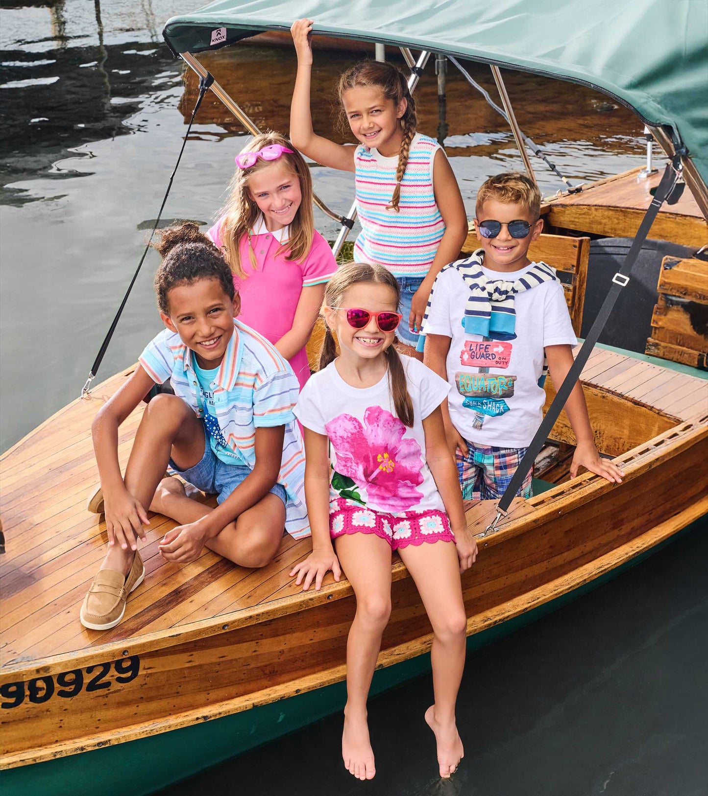 Girls white T-shirt with large pink hibiscus flower print and tie front, short sleeves, front view