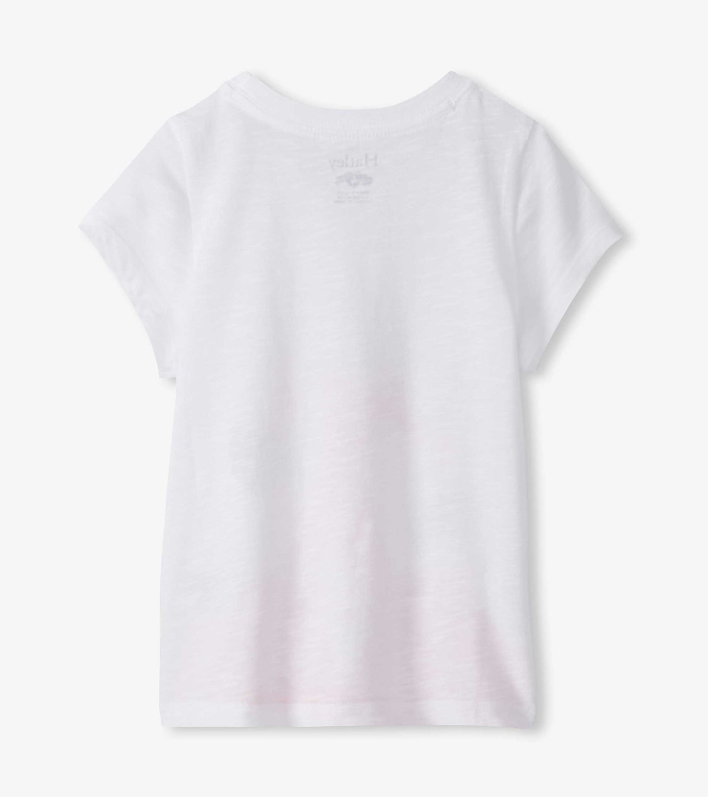 White girls graphic tee, back view, short sleeves, flamingo print faintly visible on back neck area