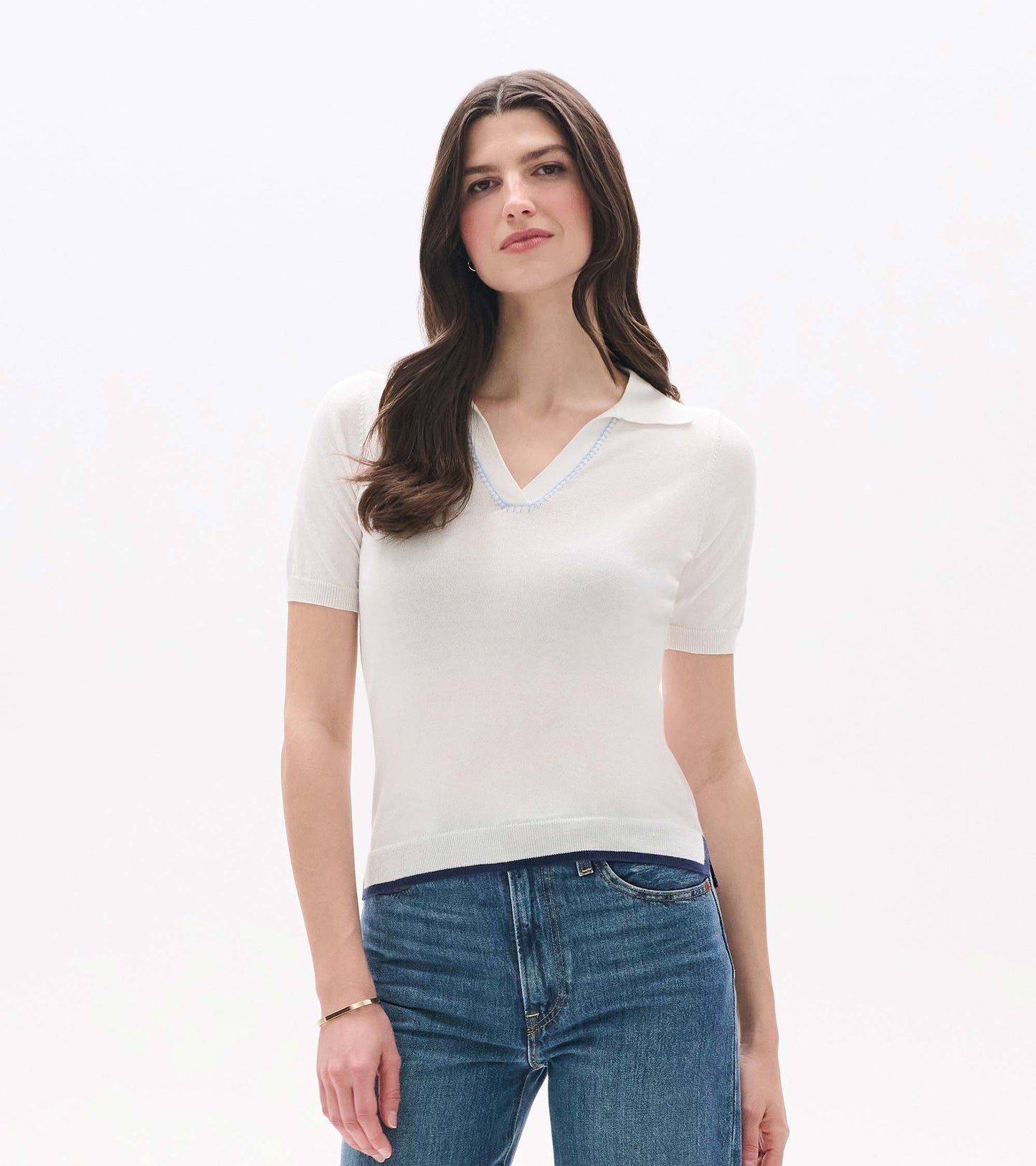 White short-sleeve knit top with Johnny collar and V-neck, shown on a model front view.
