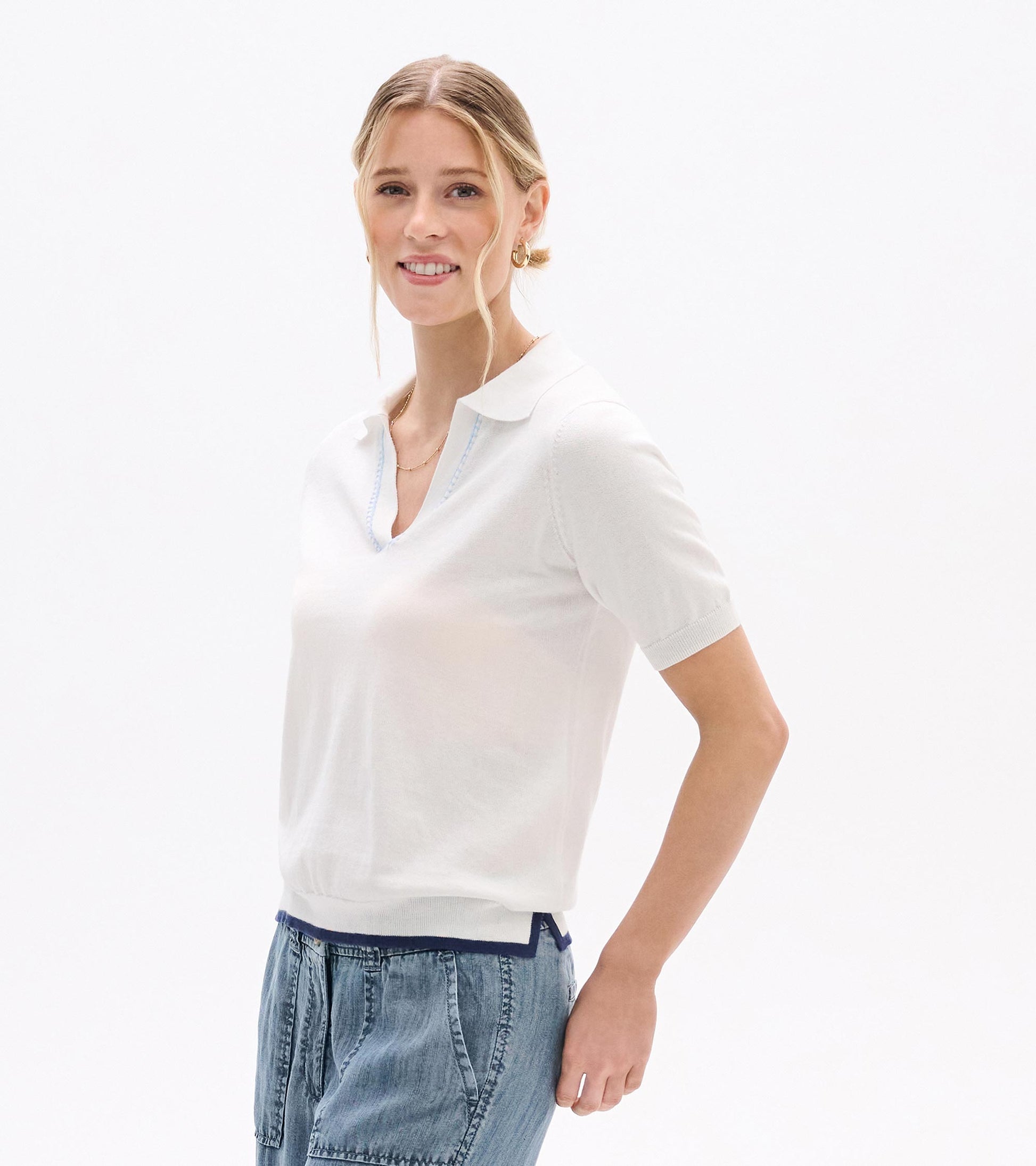 White short-sleeve knit top with Johnny collar and V-neck, shown on a model, front view.
