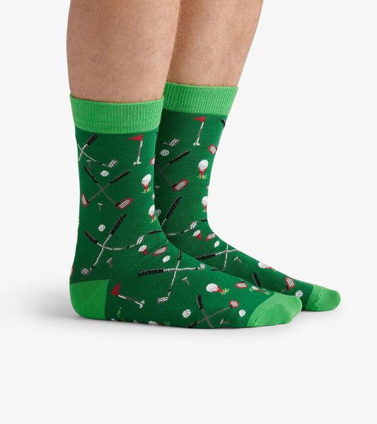 Green crew socks featuring a playful pattern of golf-related items, ideal for casual wear.