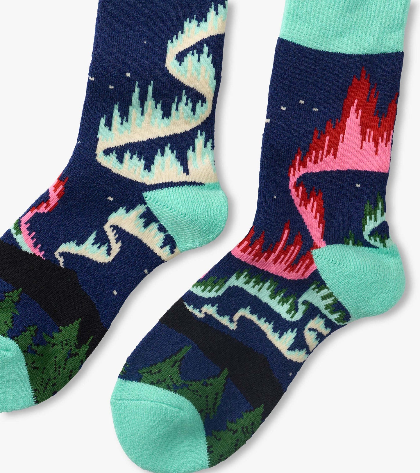 Pair of navy knit socks with colorful northern lights pattern and mint green heels, toes, and cuffs