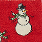 Snowman with a black top hat and red scarf on a red background, with holly leaves and berries