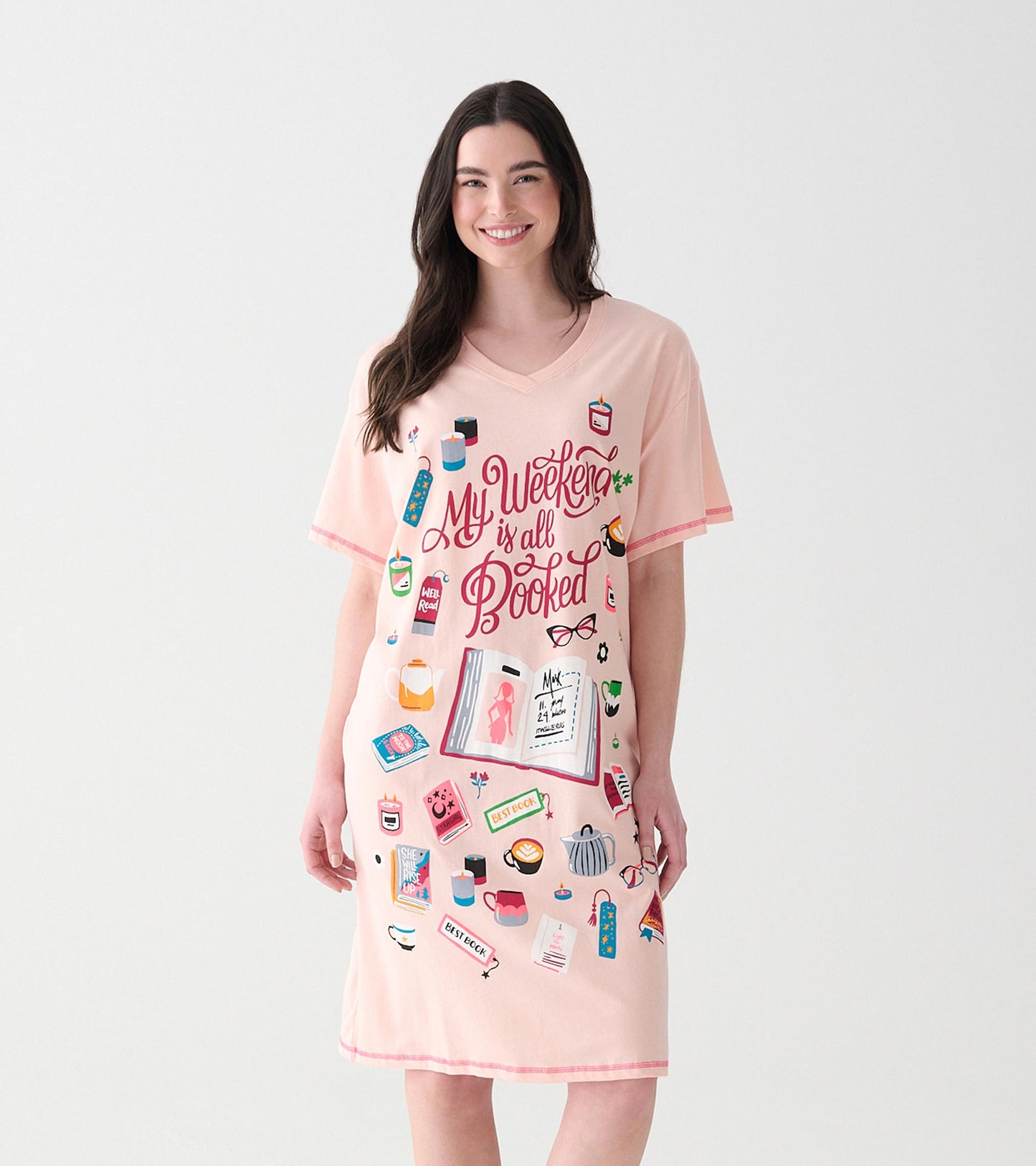 Front view of pink V-neck sleepshirt with 'My Weekend is All Booked' text and book-themed icons
