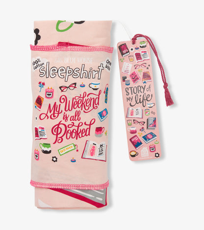 Folded pink sleepshirt with book-themed print and matching pink bookmark hang tag