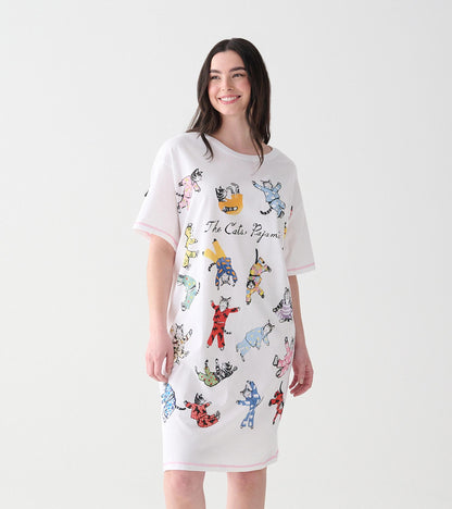 Women's white sleepshirt with colorful cats in pajamas print, shown on model from front