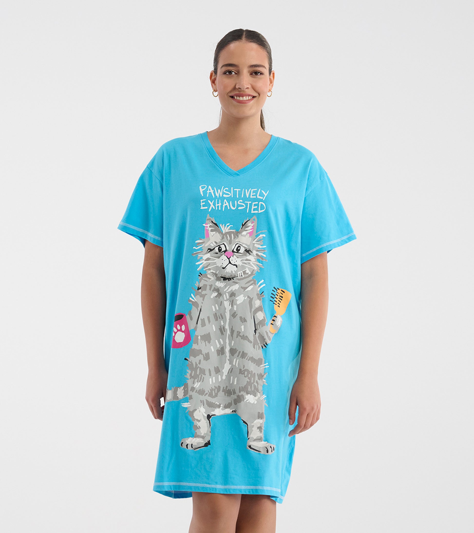 Model wearing a bright blue V-neck sleepshirt with 'Pawsitively Exhausted' text and a large gray cat graphic