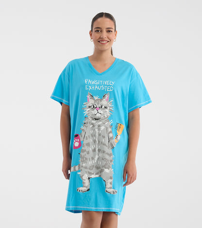 Model wearing a bright blue V-neck sleepshirt with 'Pawsitively Exhausted' text and a large gray cat graphic
